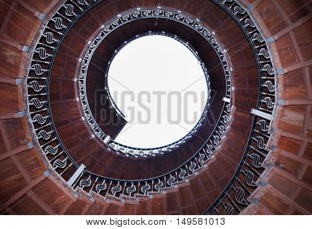 spiral staircase - view from below with partially taken sky view