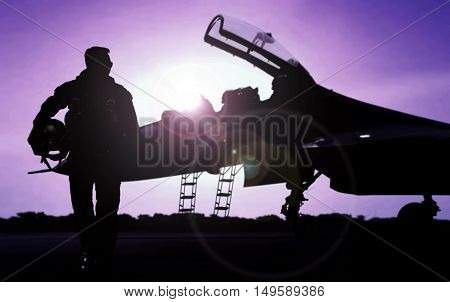 Pilot walking away from jet fighter after a mission