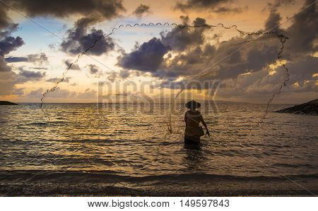old fisherman in a sea in Bali Indonesia