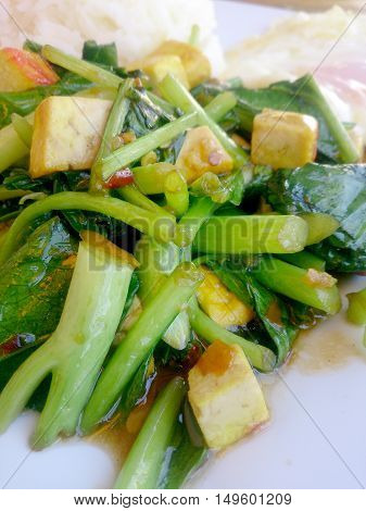 Stir Fried Chinese Kale With Tofu In White Plate.. Vegetarian Food, Healthy Food.