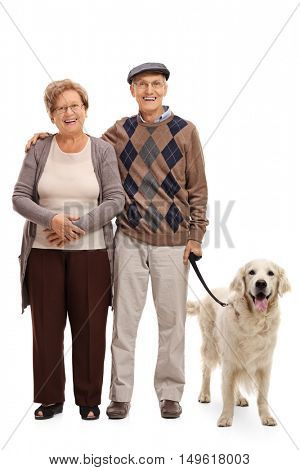 Full length portrait of a happy senior couple posing with their dog isolated on white background