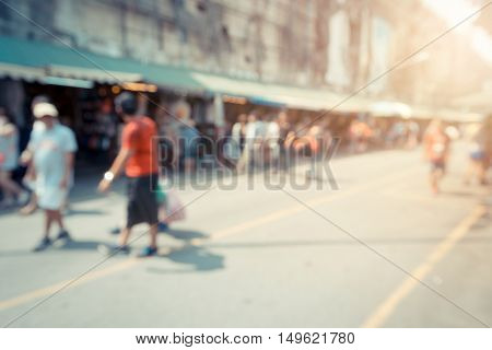 Blurred background : people shopping at market fair in sunny day blur background with bokeh