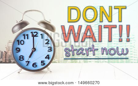 Dont wait start now text with blue alarm clock