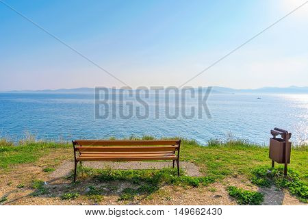 Bench with sea view and blue sky