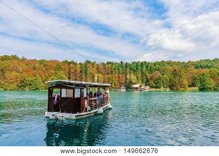 Boat on Plitvice lake in a scenic setting