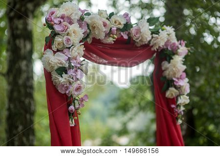wedding decor flower arch of red color