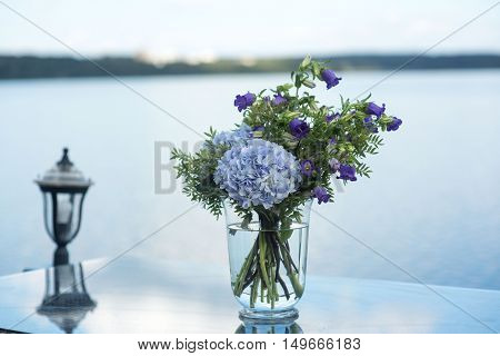 wedding decor on tables flowers blue and violet