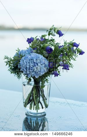 wedding decor on tables flowers blue and violet