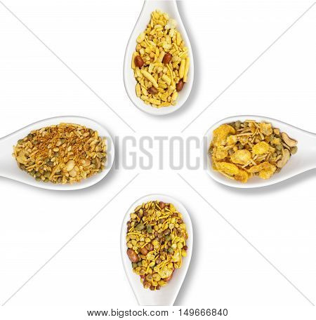 Dry roasted Indian snack mix in a big spoon isolated