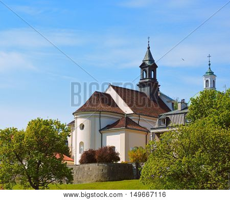 Church of St. Benon in Warsaw city, Poland - view at old town from Visla river