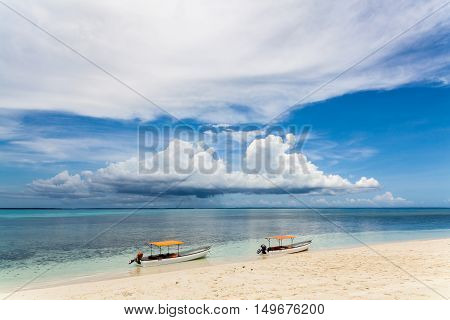 Two fisherman boats on the beach.Tropical seascape, Zanzibar Island, Tanzania