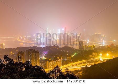 CHONGQING CHINA - DECEMBER 31: View form Yikeshu mountain in Chongqing which is a famous landmark in the distance you can see Chongqing's financial district and other buildings on December 31st 2014 in Chongqing