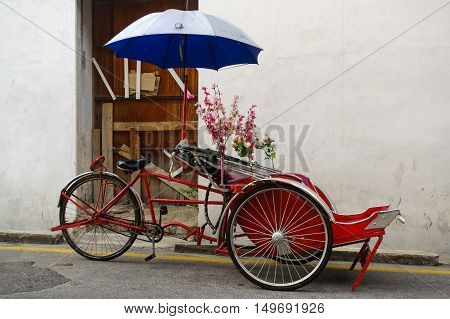 Georgetown Penang Malaysia - April 18 2015: Classic local rickshaw in George Town Penang in Malaysia
