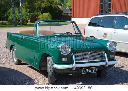 LOVIISA, FINLAND - AUGUST 20, 2016: Vintage car Triumph Herald 1200 Convertible on the streets of the city of Loviisa. Tourist landmark