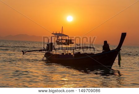 Sunset view wirh boats at pranang beach of Railay Krabi Thailand 