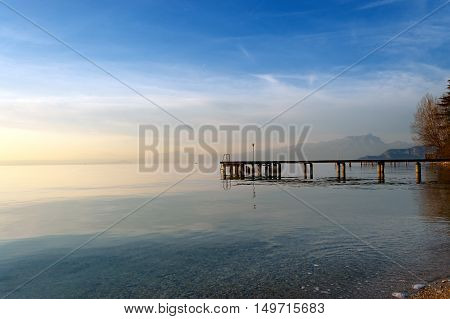 Lago di Garda at twilight in winter (Garda Lake) the largest Italian lake of glacial origin. Lazise Veneto Italy