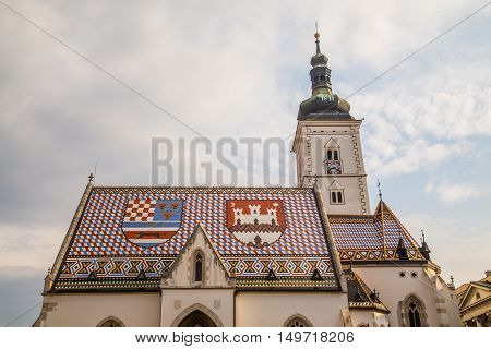 ZAGREB CROATIA - 17TH AUGUST 2016: A closeup to the roof of St Marks Church in central Zagreb Croatia during the day.