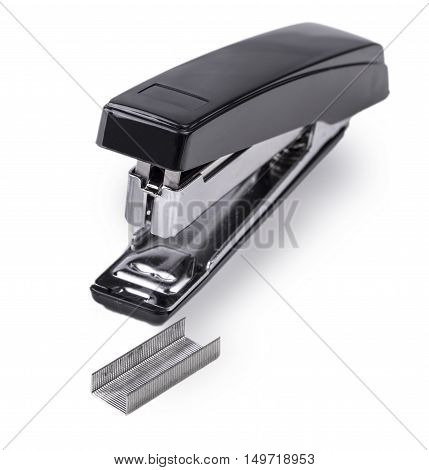 Black stapler and staples to him isolated on white background