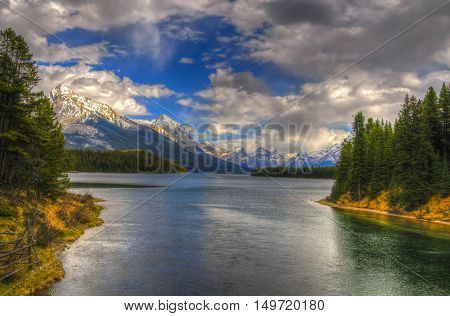 Scenic Maligne Lake and trout spawning river in the Canadian Rocky Mountains Jasper National Park Alberta