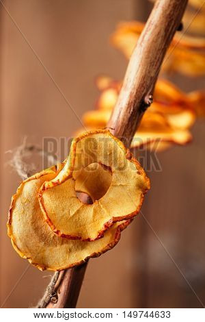 Dried apple slices and wooden backdrop