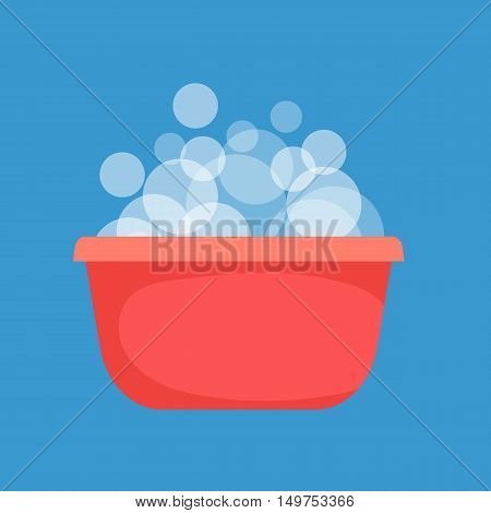 Red plastic bowl with very soapy water