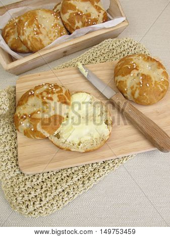 Homemade lye roll cut in half and buttered
