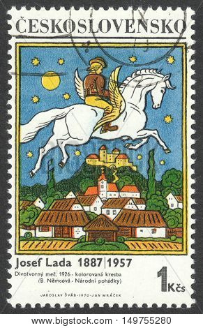 MOSCOW RUSSIA - CIRCA SEPTEMBER 2016: a stamp printed in CZECHOSLOVAKIA shows a paintings by Josef Lada the series 
