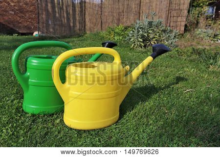 green and yellow sprinkler in the garden