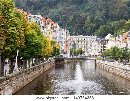 Tepla riverhomes and autumn trees in Karlovy Vary (Karlsbad) Czech Republic.
