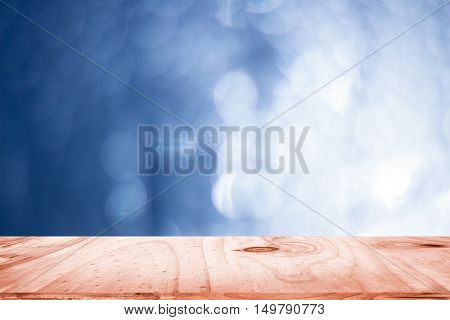empty wood and dark blue blurred background / can be used display your product or art work