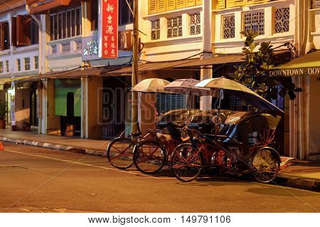 Georgetown Penang Malaysia - April 18 2015: Classic local rickshaws in George Town Penang in Malaysia