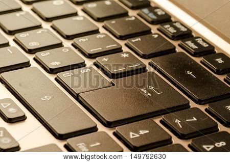 close up of a personal computer with italian keyboard with enter command symbol of decision