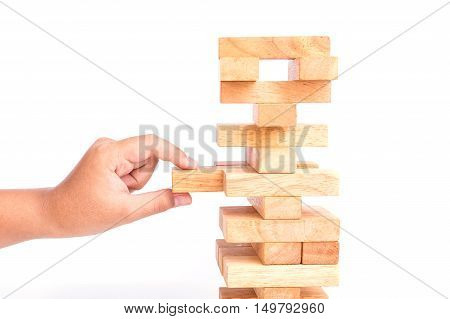 Hand Holding Blocks Wood Game (jenga) Isolated On White Background. Risk Concept