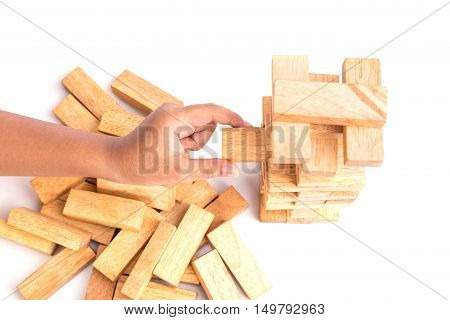 Hand Holding Blocks Wood Game (jenga) Isolated On White Background. Risk Concept