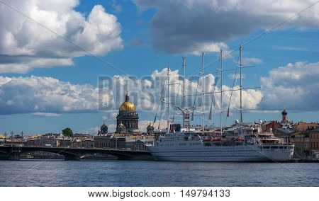 St. Petersbug Russia - August 5 2015: Cruise liner Wind Surf of Windstar Cruises Luxury Lines departs from the Neva river. The 5-masts ship provides luxury cruise for 310 guests