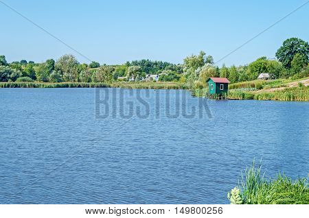 View of the pond in clean rural midday in late August