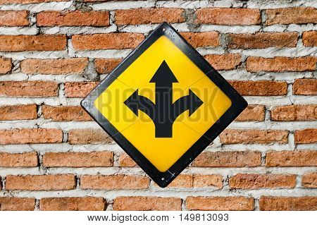 T-junction sign steel plate on brick wall