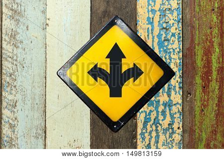 T-junction sign steel plate on wood wall