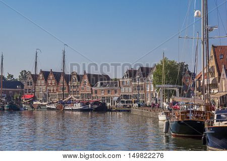 HOORN, NETHERLANDS - SEPTEMBER 13, 2016: Boats and old houses in the harbor of Hoorn, Netherlands