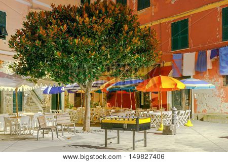 The old main square on the waterfront in the Italian village of Vernazza at night. Parco Nazionale delle Cinque Terre, Liguria, Italy.