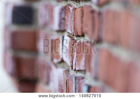 Section of old brick wall showing deterioration