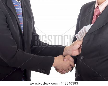 Businessman giving a bribe to the pocket for corruption something on isolated / white background