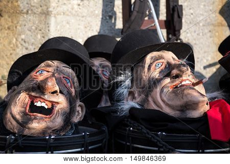 Basel, Switzerland - March 10, 2014: Masks lying around at the tradtional carnival parade