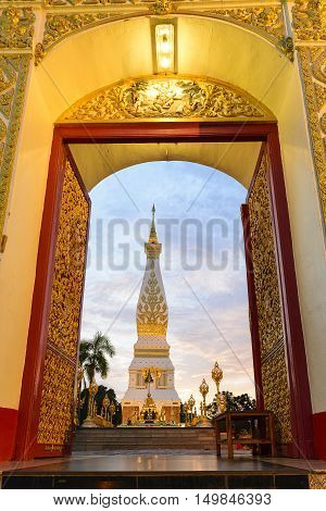 The Pratat Pranom pagoda from the door view with the twilight scene.