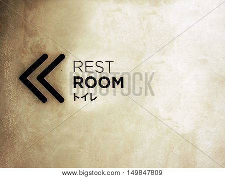 Signs rest room on the dirty walls