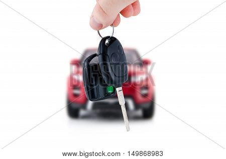 Hand holding keys to new red car. Buy or selling business composition