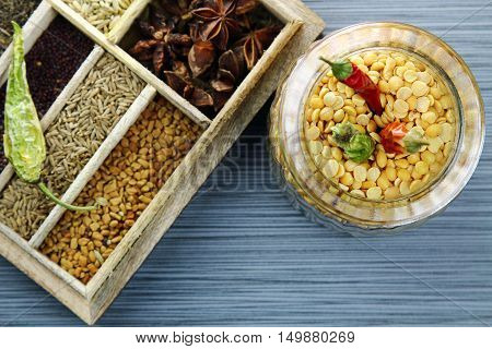 Overhead view of a glass jar of yellow split lentils or arhar daal selective focus and copy space