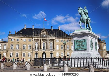 Copenhagen Denmark - August 15 2016: Sculpture of Frederik V on Horseback in Amalienborg Square it's home of the Danish Royal family in Copenhagen Denmark on August 15 2016.