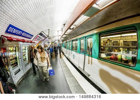 Tourists And Locals On A Subway Train In Paris