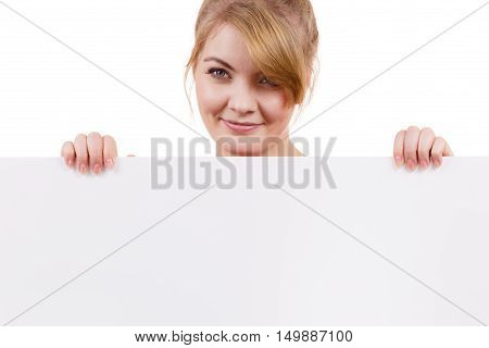 Woman with blank presentation board. Female model showing banner sign billboard copy space for text looking down at it. Advertisement concept.